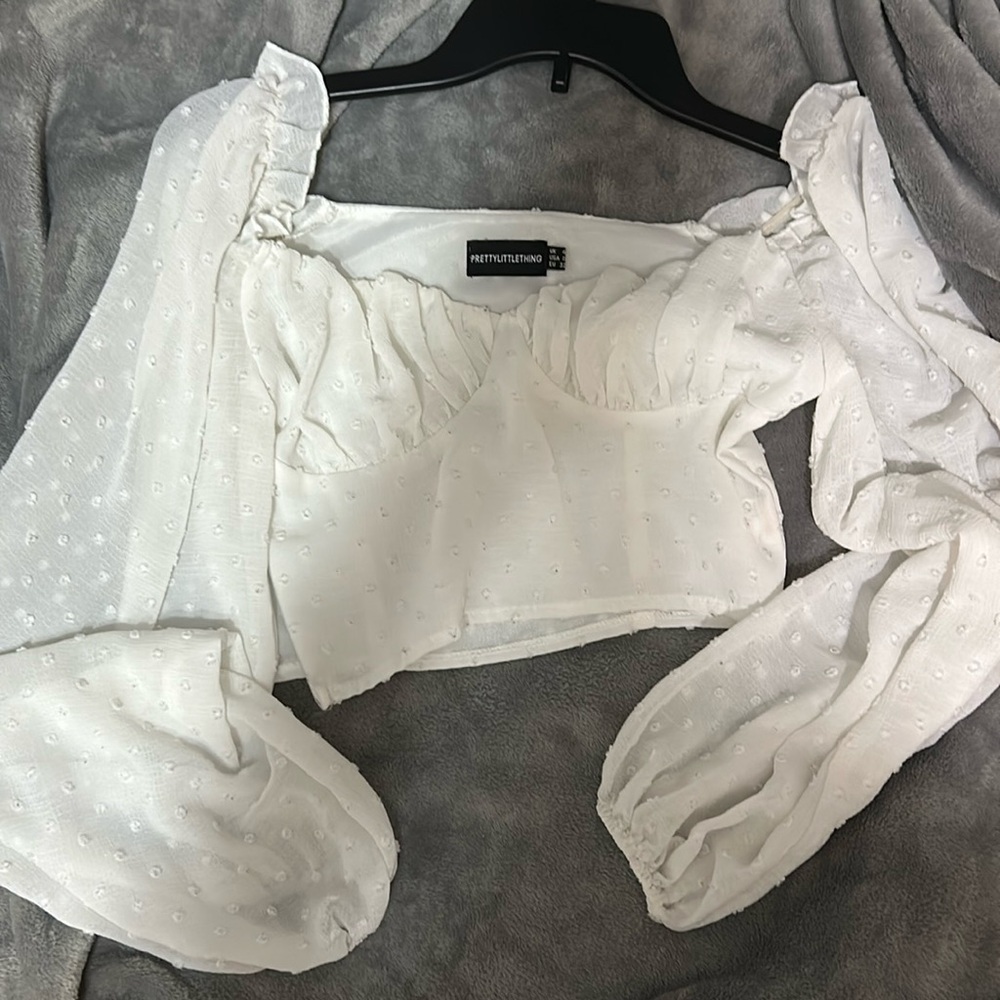 Prettylittlething white cropped top with little designs and corset top.